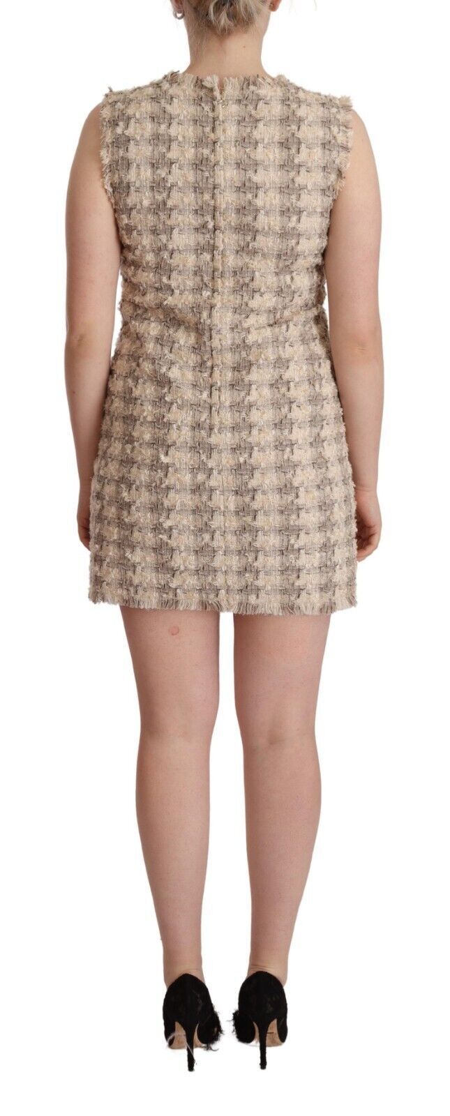 A sleeveless mini shift dress with a beige checkered pattern