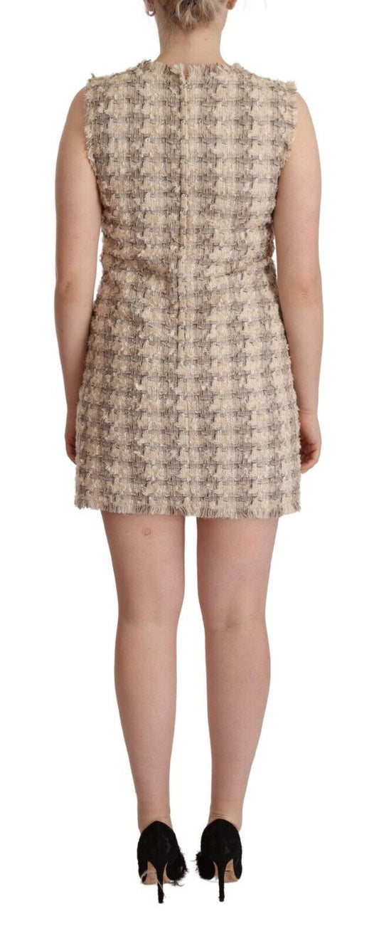 A sleeveless mini shift dress with a beige checkered pattern