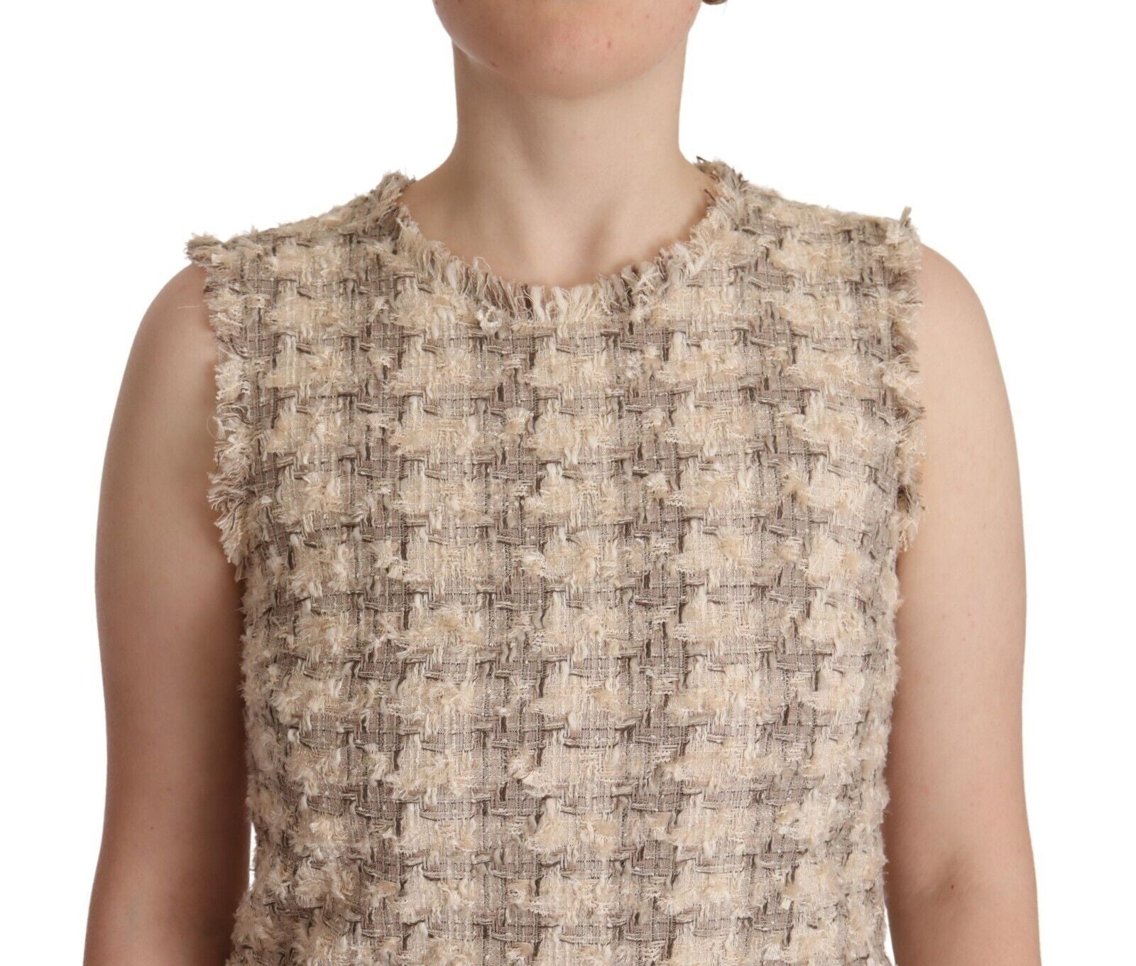 A sleeveless mini dress with a beige checkered pattern
