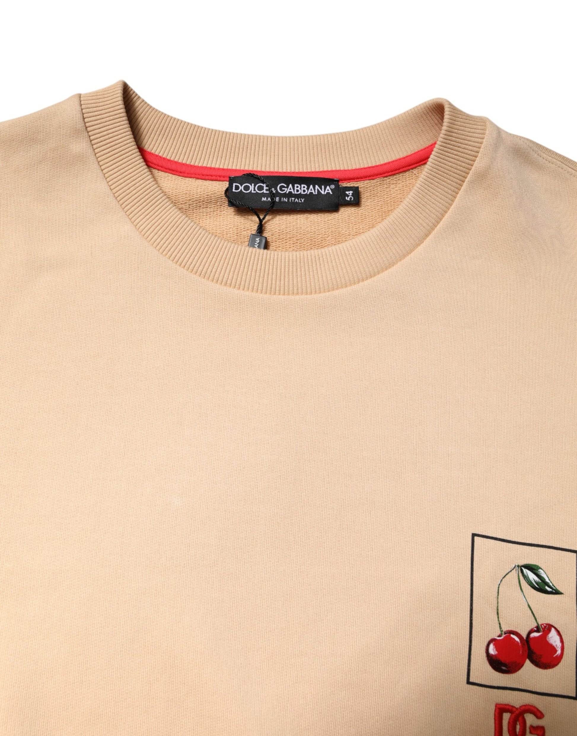 Tan sweater with cherry embroidery on front pocket