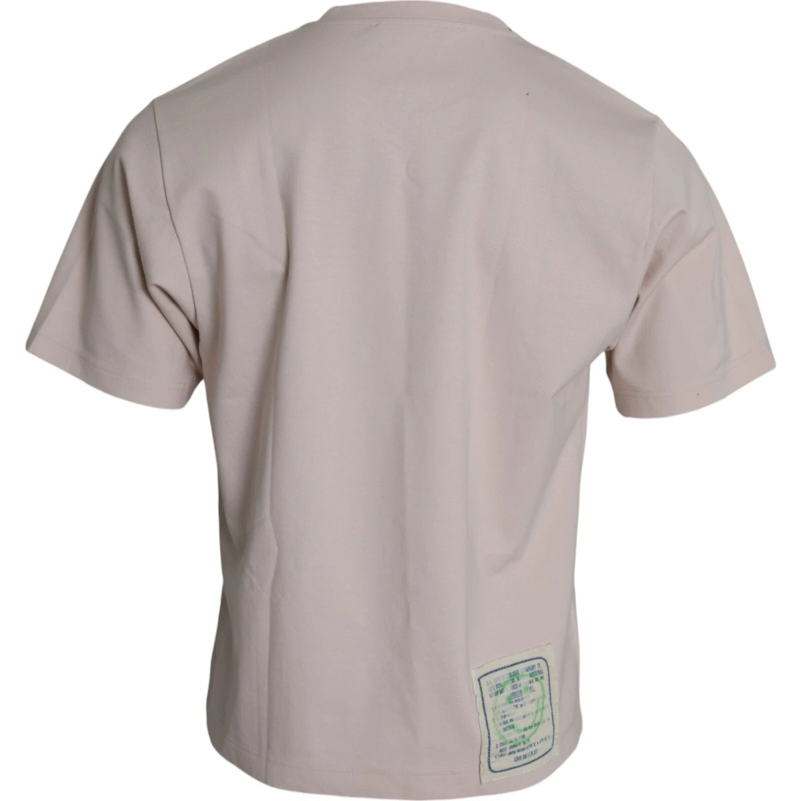 Pink short sleeve shirt with green tag on back