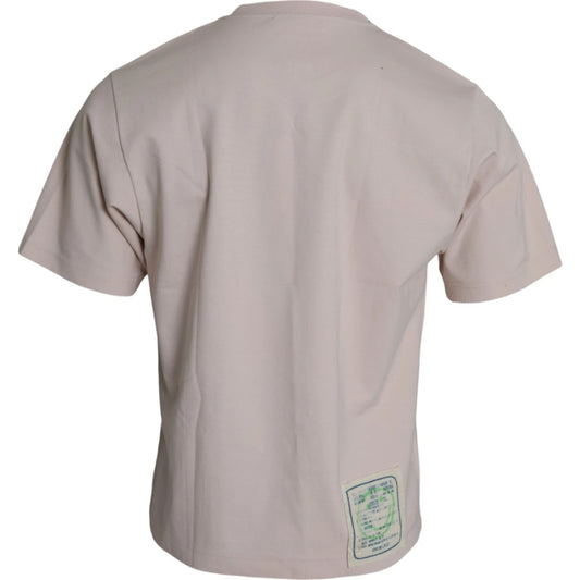 Pink short sleeve shirt with green tag on back
