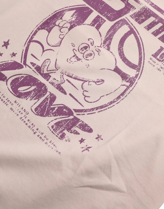 Pink t-shirt with cartoon character and text