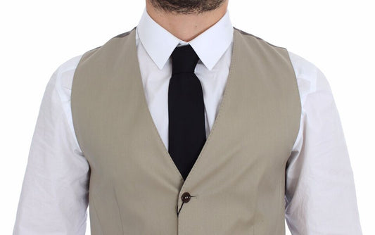 A beige cotton vest jacket with a black tie, part of the Dolce & Gabbana collection