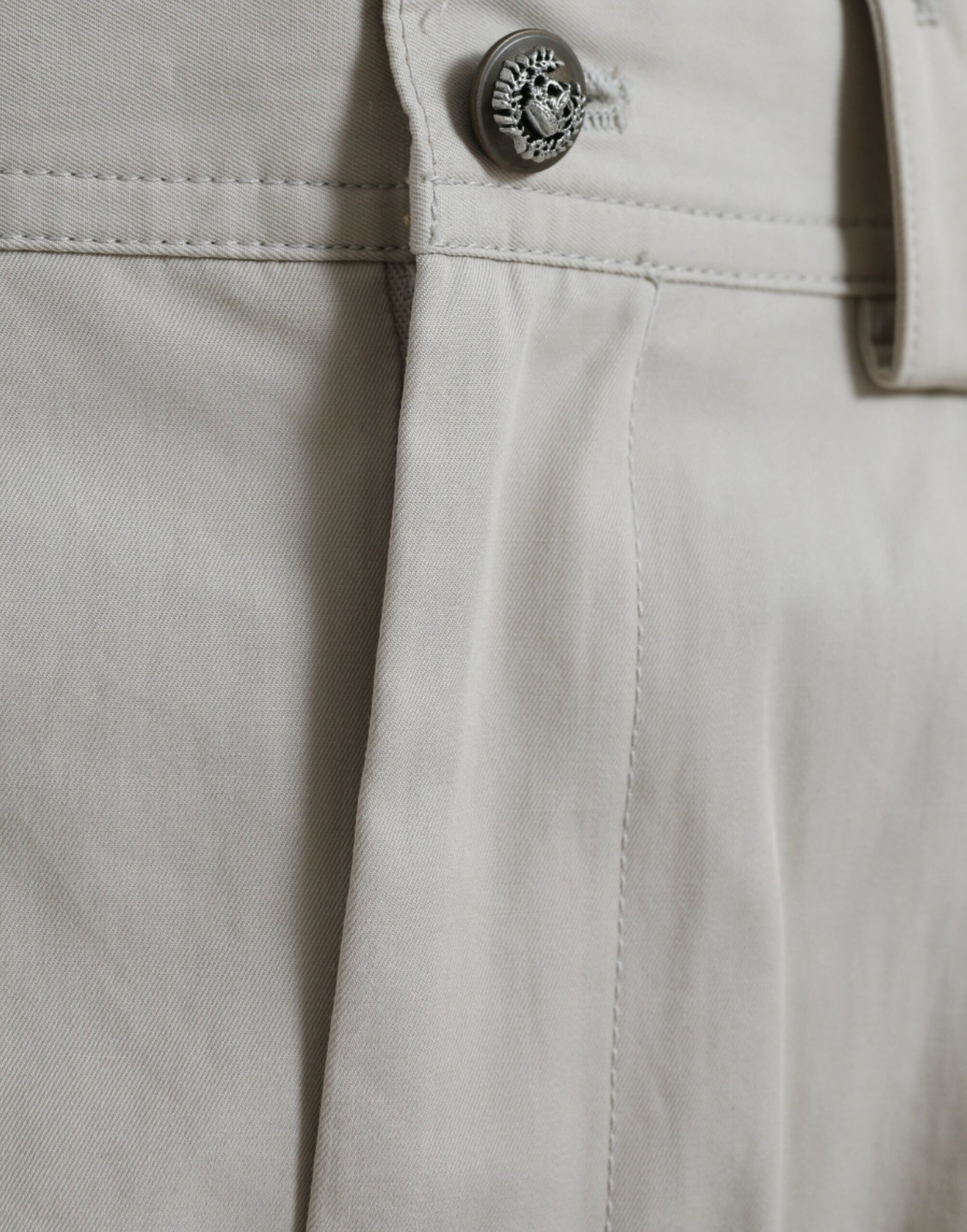 Pair of khaki pants with button closure