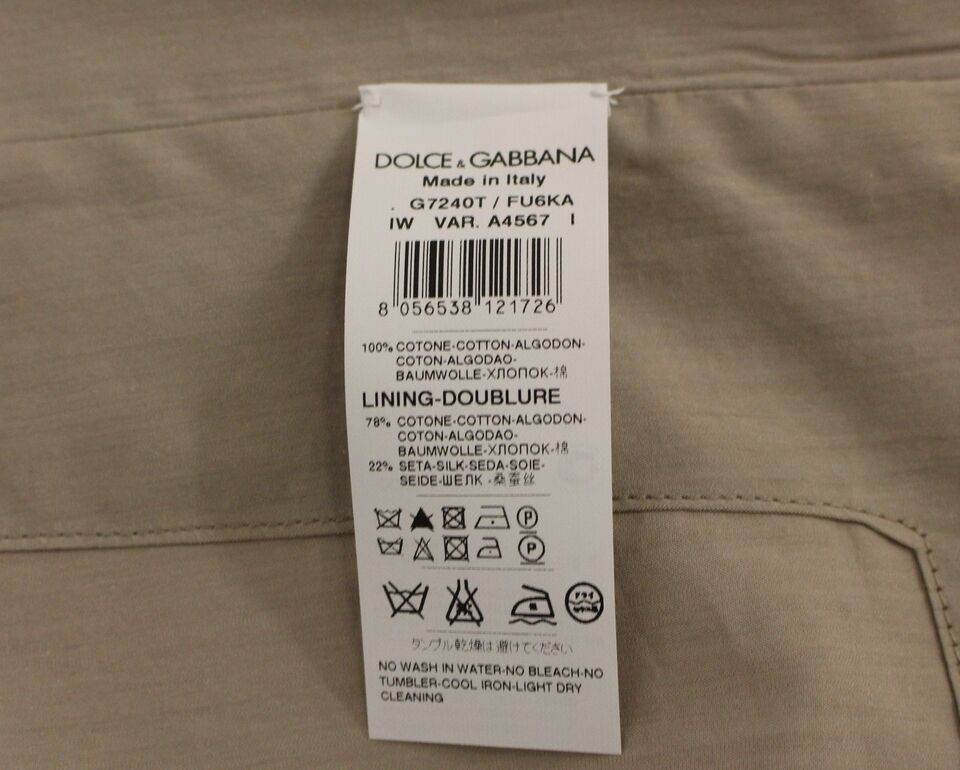A beige cotton slim fit button front vest from Dolce & Gabbana