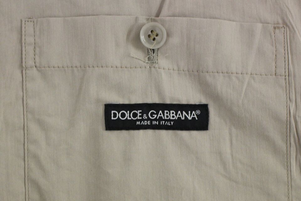 A beige cotton slim fit button front vest from Dolce & Gabbana