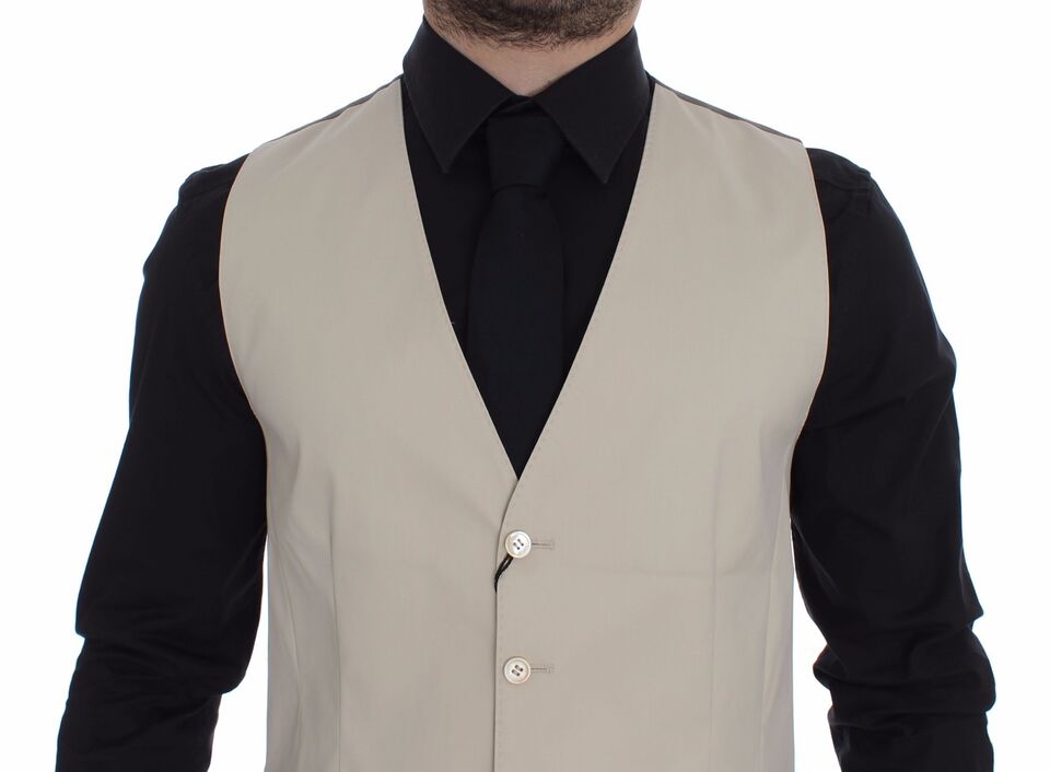 A beige cotton stretch vest blazer with a black shirt underneath