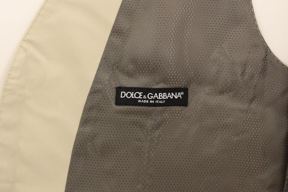 A beige cotton stretch vest from Dolce & Gabbana, featuring a textured pattern and the brand's logo