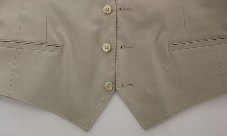 Tan cotton dress vest with two buttons, front pockets and a notch lapel