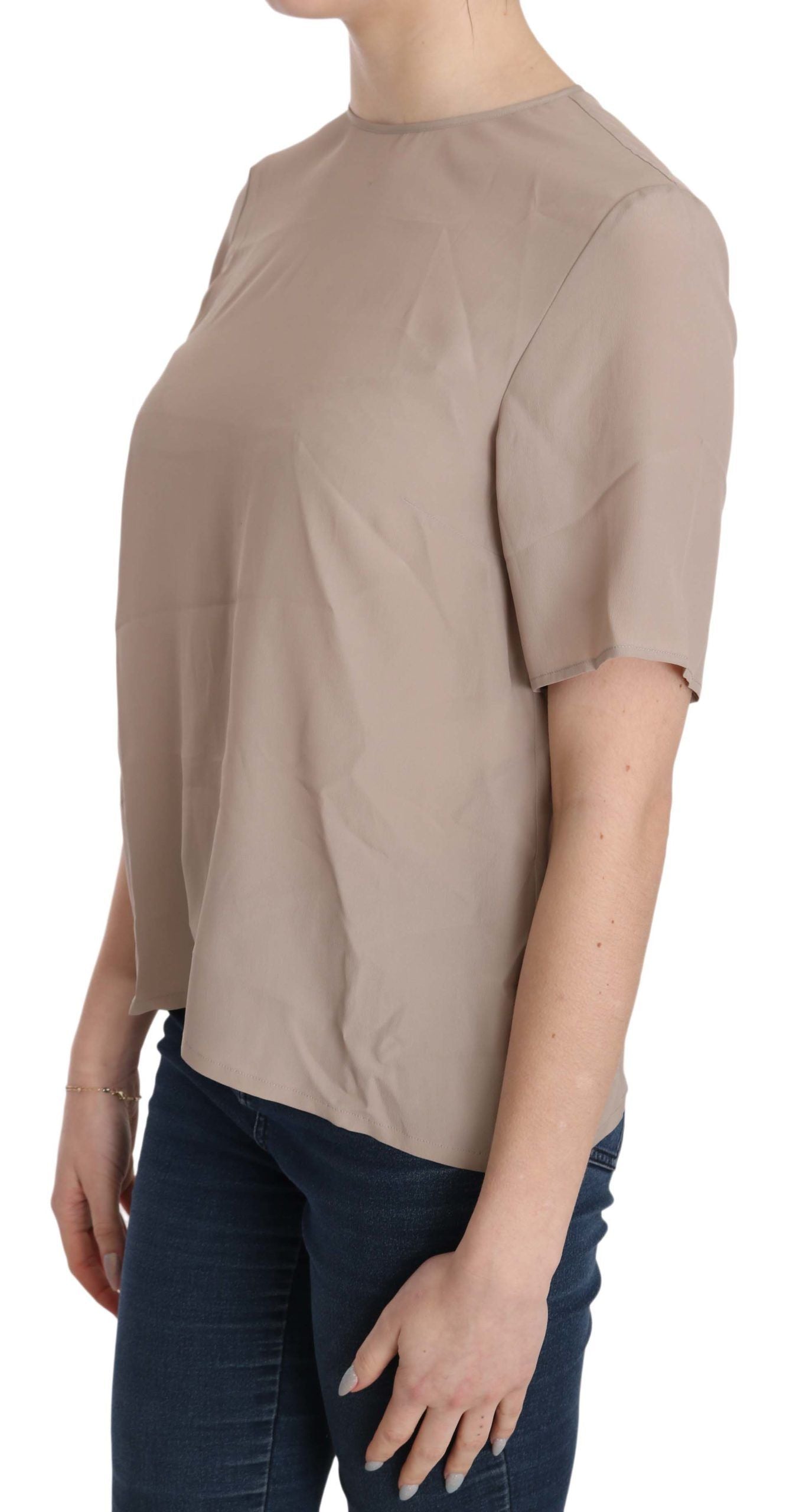 Woman wearing beige top
