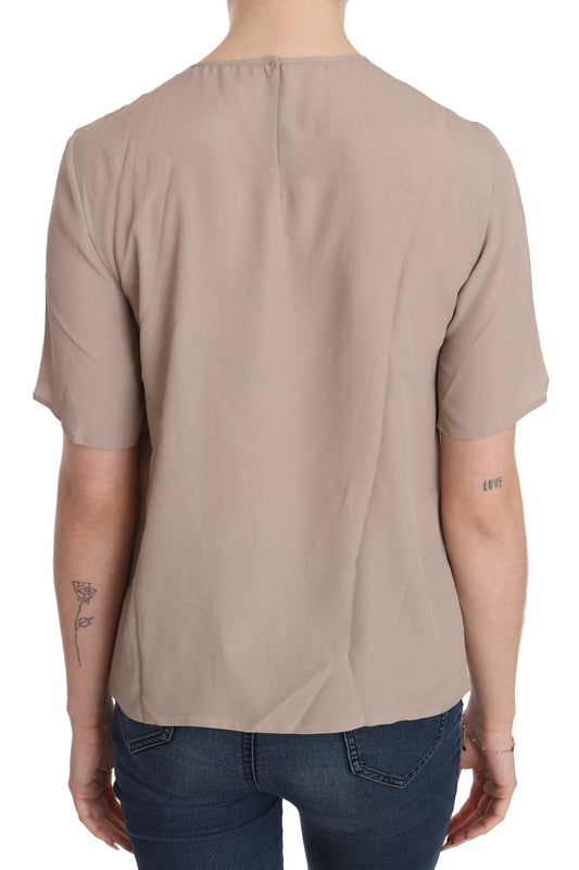 Backless beige top on a mannequin