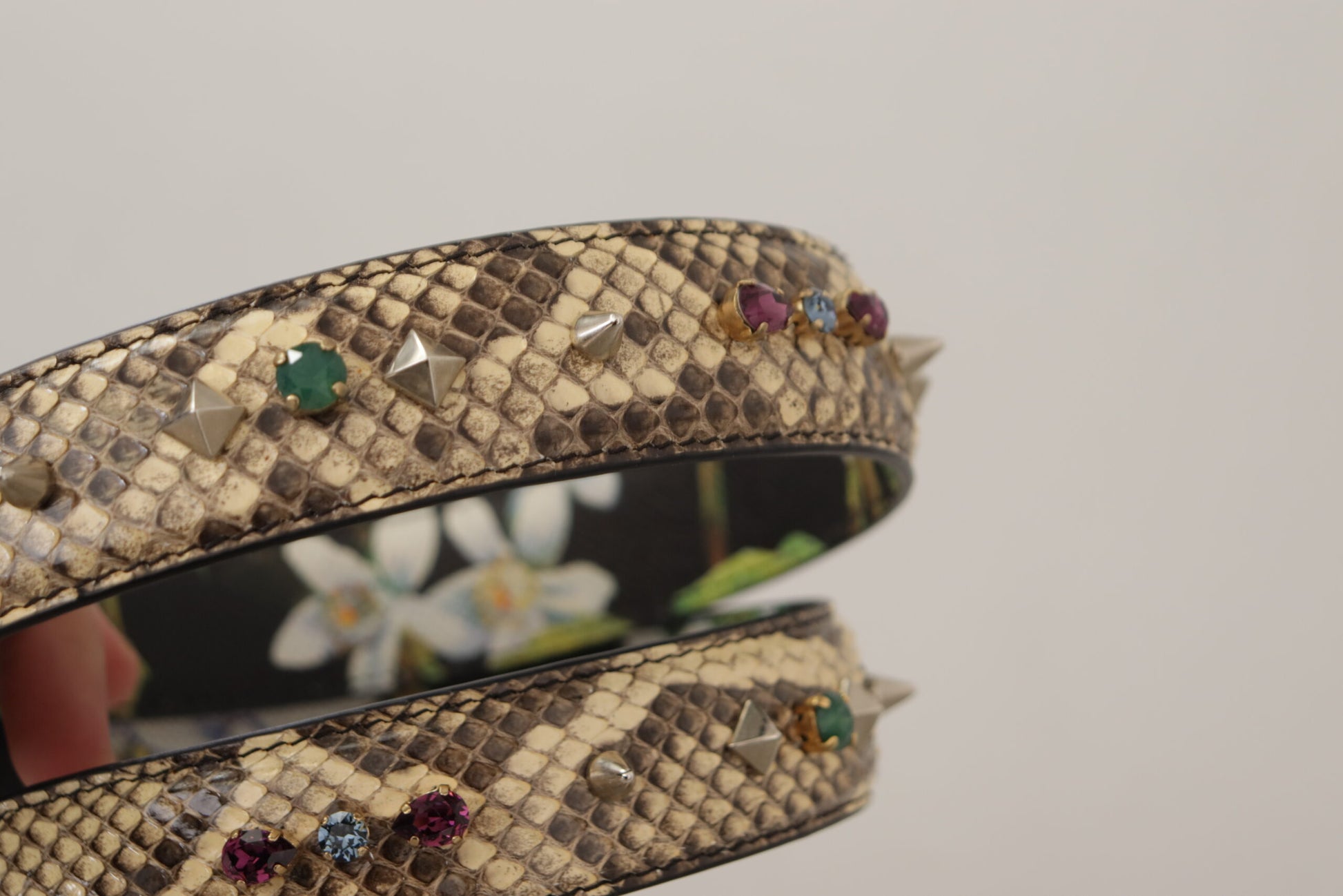 Decorative bracelet with snake skin texture and multiple colored gemstones