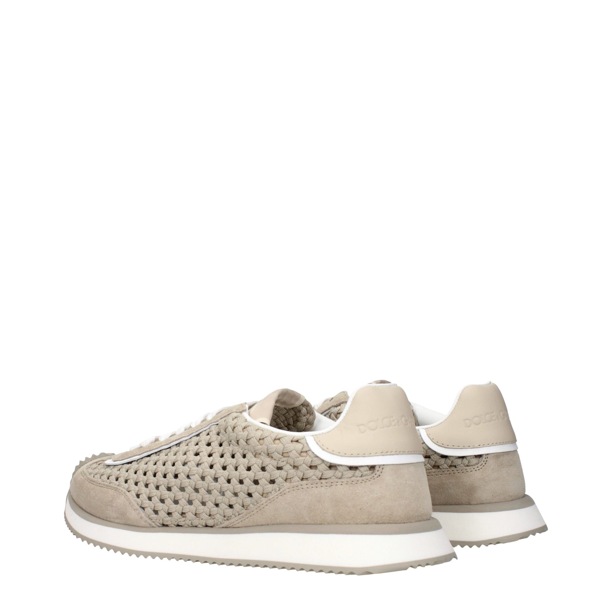 Tan suede sneakers with white laces, embroidered logo and textured side panels