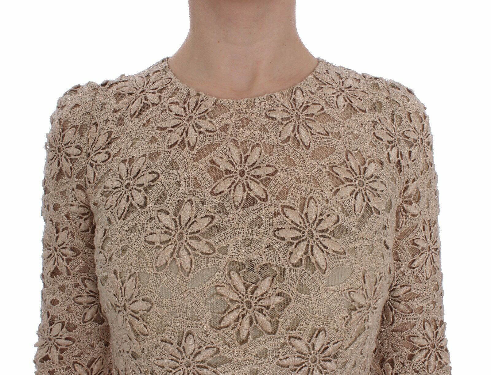 A beige floral lace sheath maxi dress with long sleeves and a V-neckline