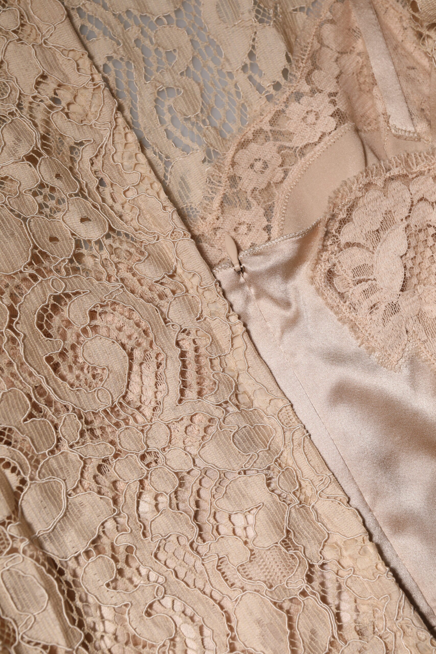 A beige floral lace sleeveless sheath dress by Dolce & Gabbana