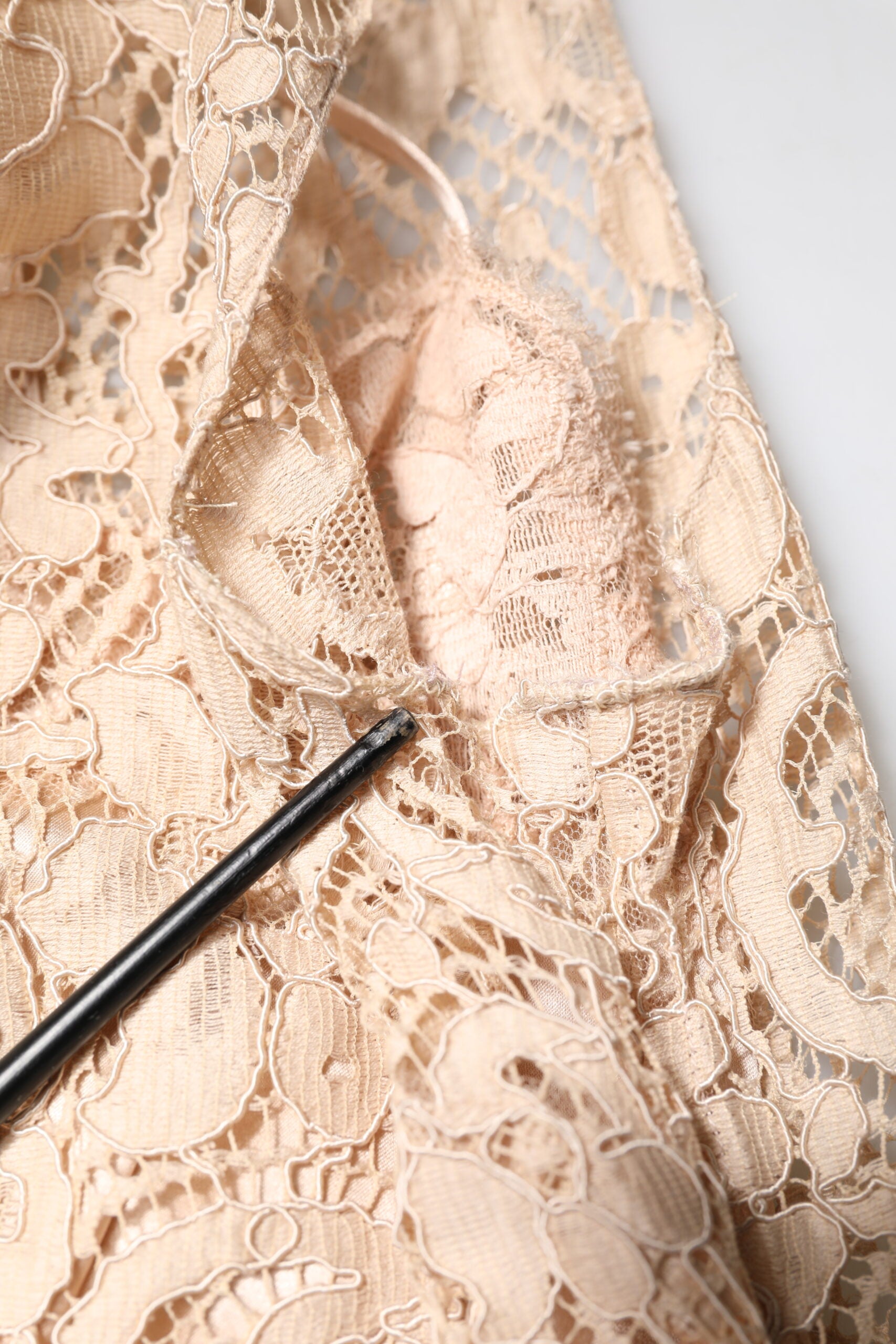 A beige floral lace sleeveless sheath dress by Dolce & Gabbana