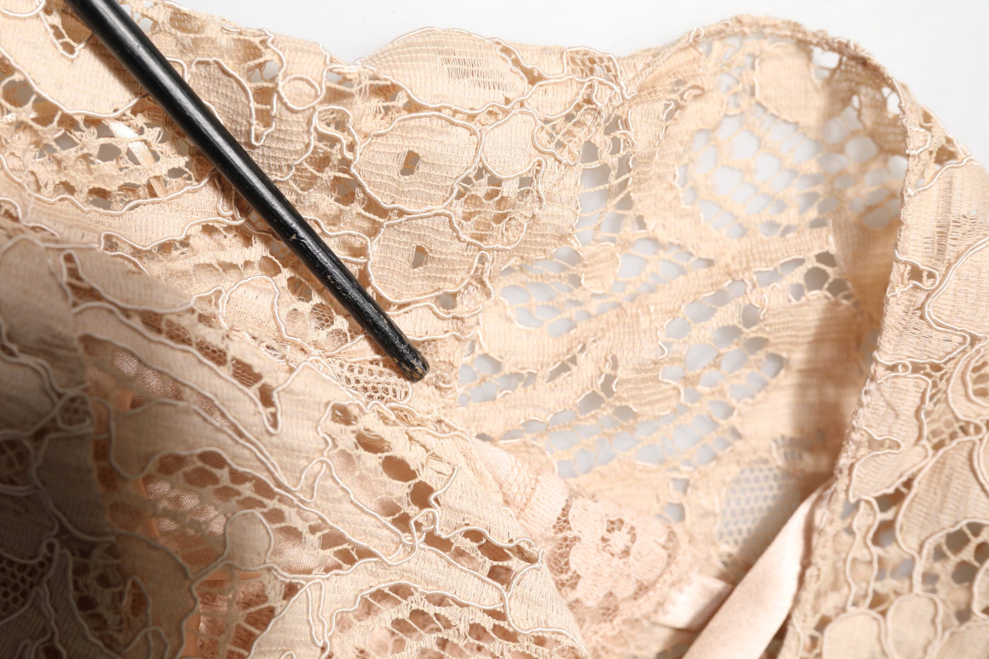 A beige floral lace sleeveless sheath dress by Dolce & Gabbana