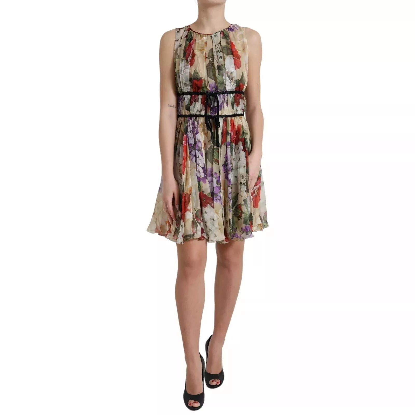 A woman wearing a beige floral sleeveless dress