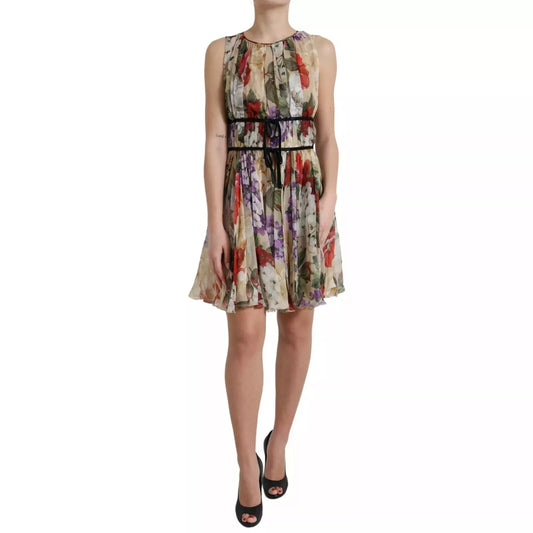 A woman wearing a beige floral sleeveless dress