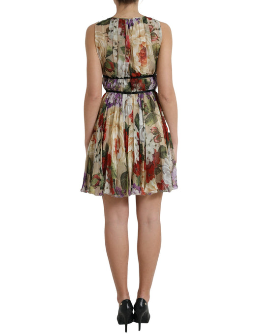 A beige floral sleeveless mini dress with an A-line silhouette