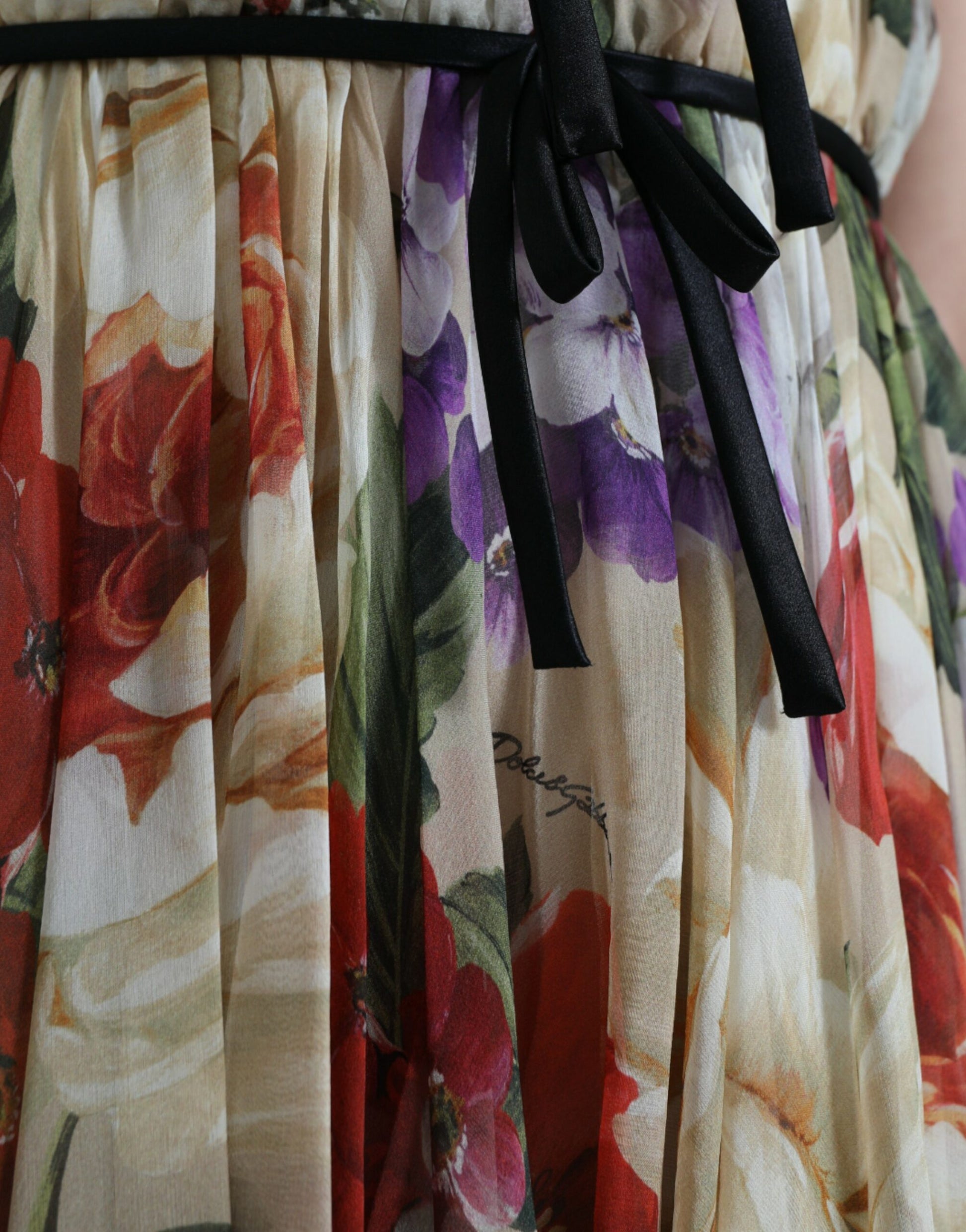 A beige floral sleeveless A-line mini dress