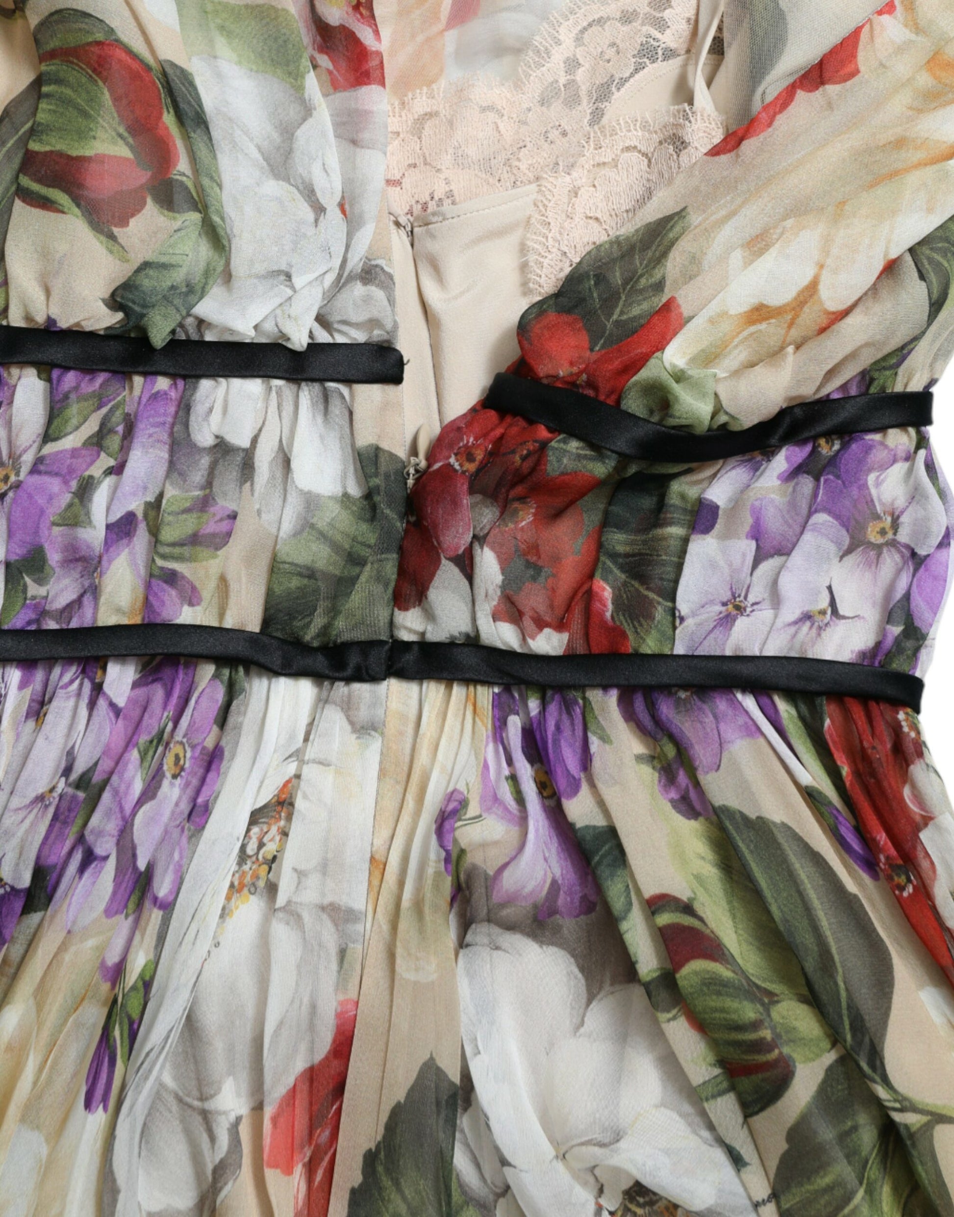 A beige floral sleeveless dress with a black belt
