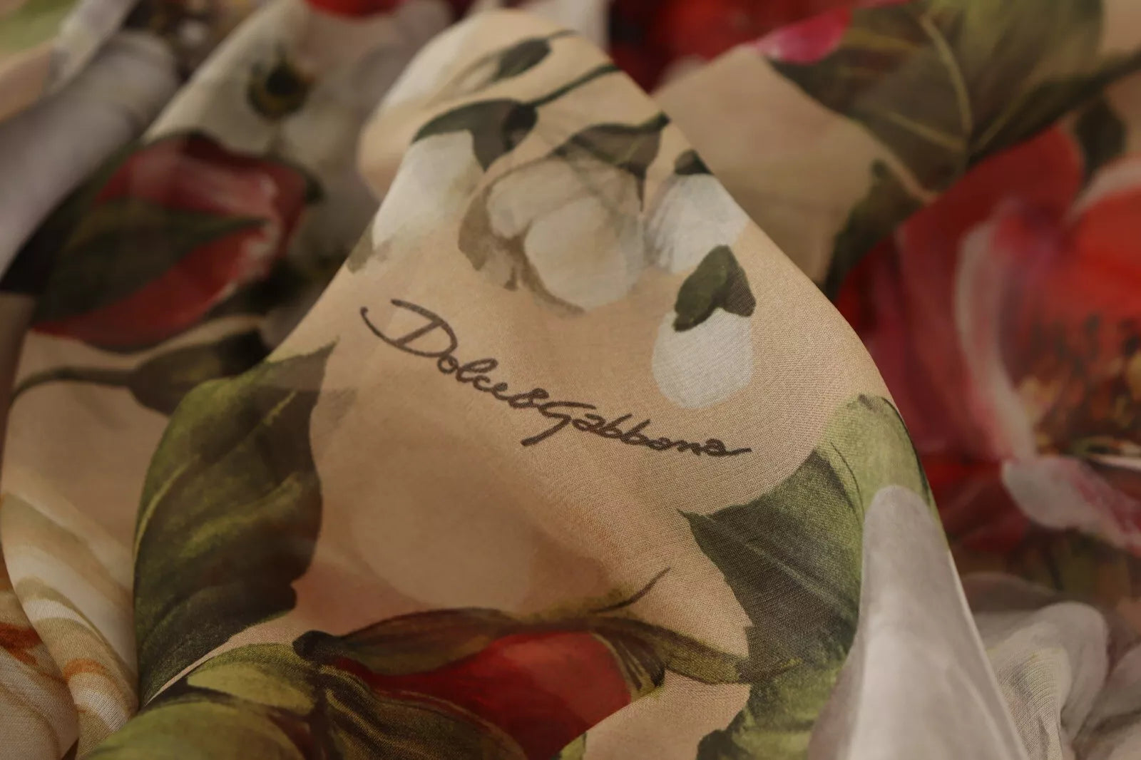 A beige floral sleeveless mini dress by Dolce & Gabbana