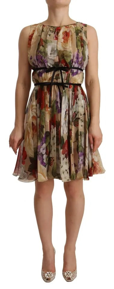 A sleeveless, round neck mini dress with floral pattern and belt