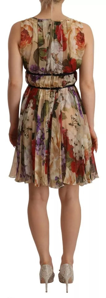 A sleeveless, round neck mini dress with floral pattern and beige color