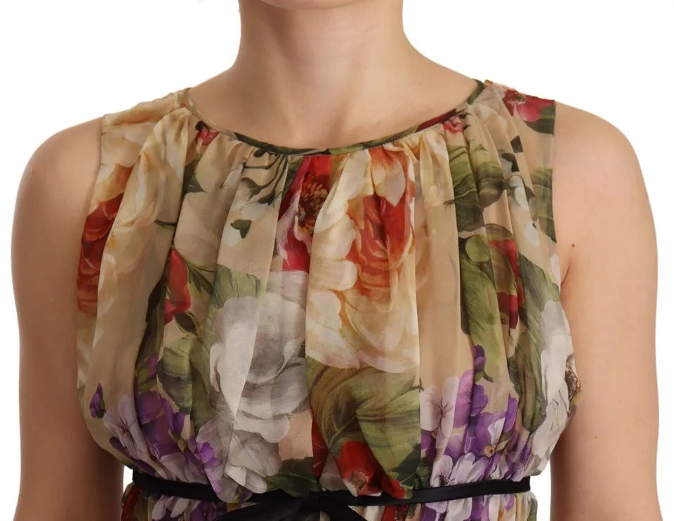 A sleeveless, round neck mini dress with a floral pattern