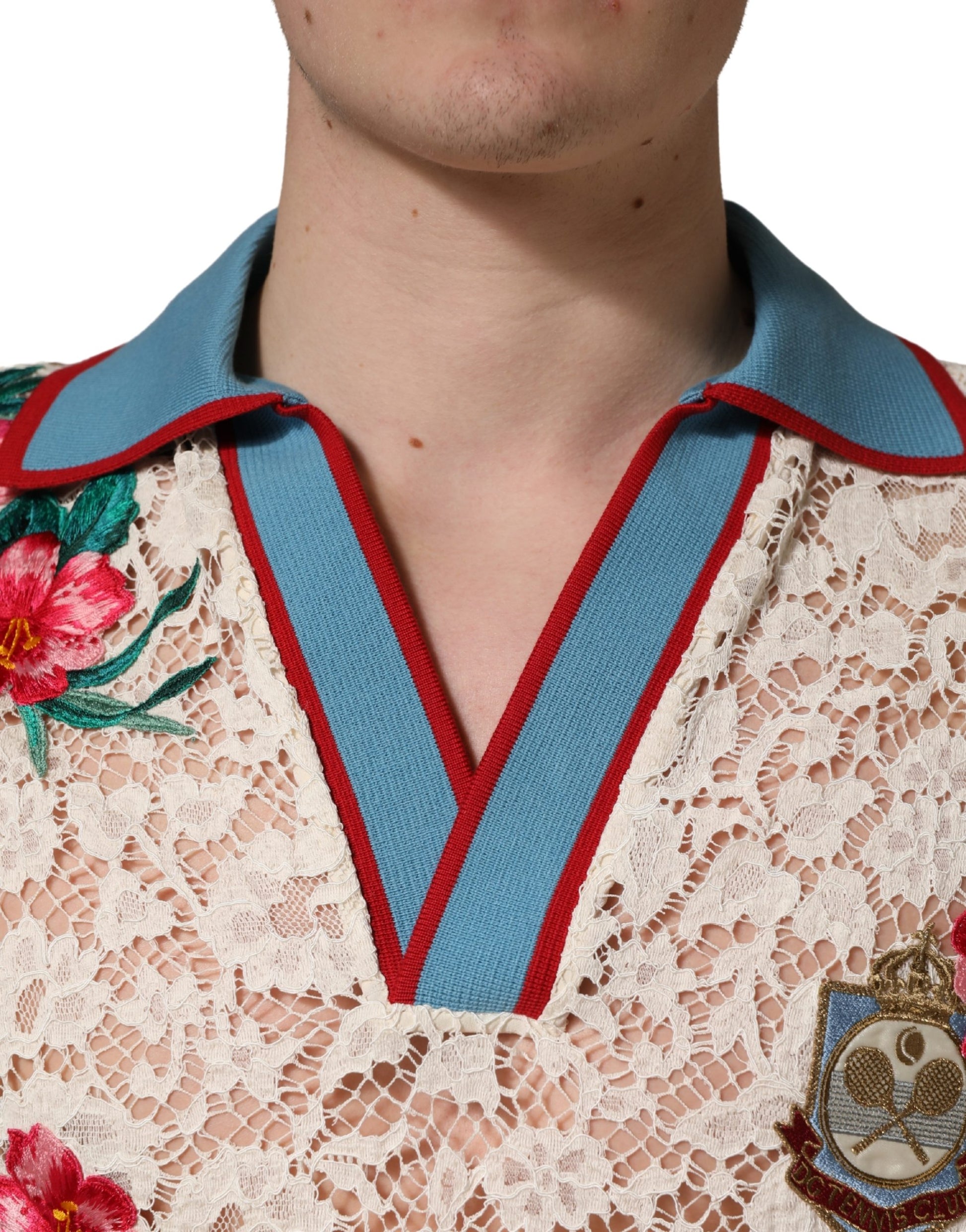 Man wearing a lace shirt with floral pattern and a blue collar