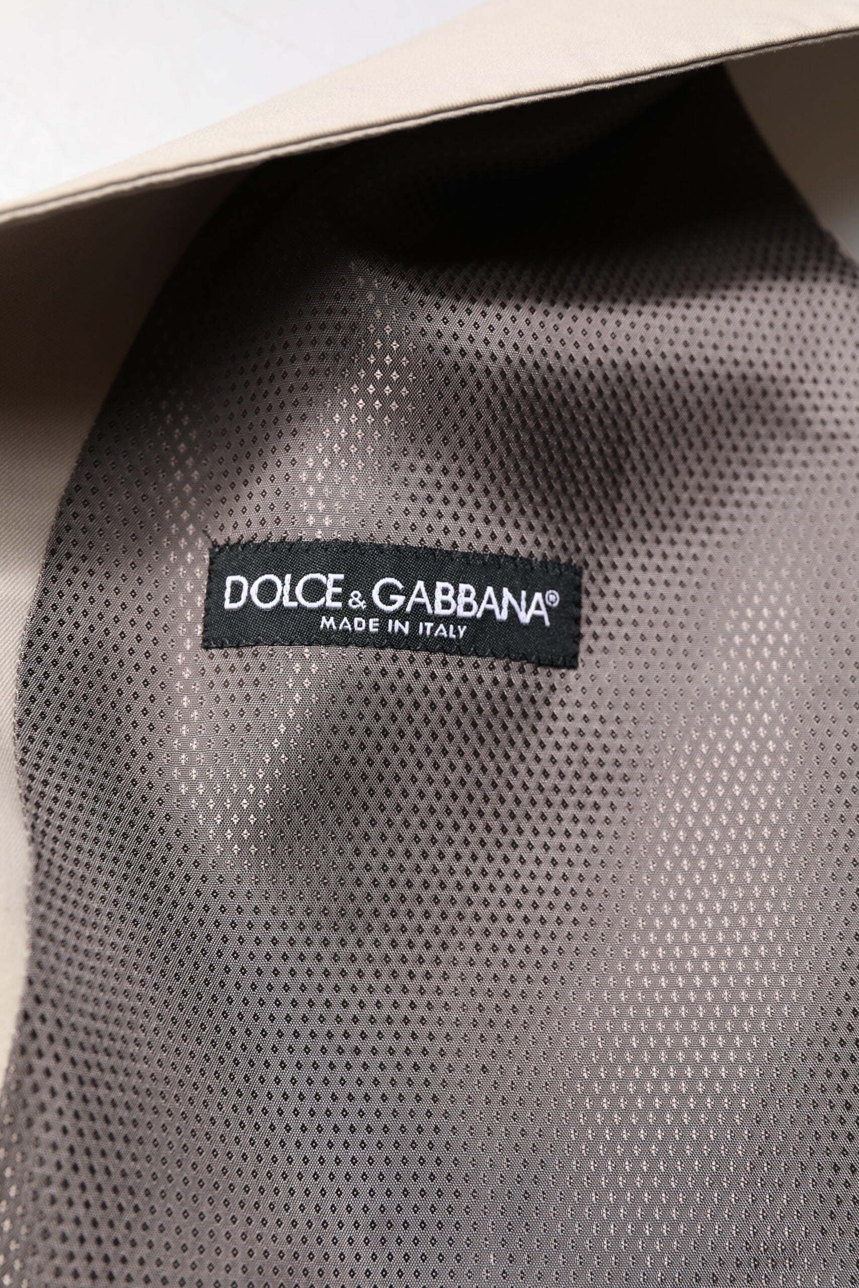 A beige gray vest from Dolce & Gabbana, part of a men's formal wear collection