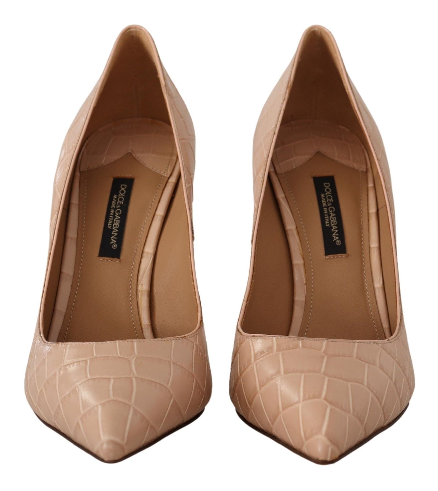 Pair of women's dress shoes with pointed toe and embossed logo on insole