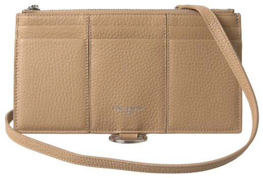 Brown leather crossbody bag with metal accents