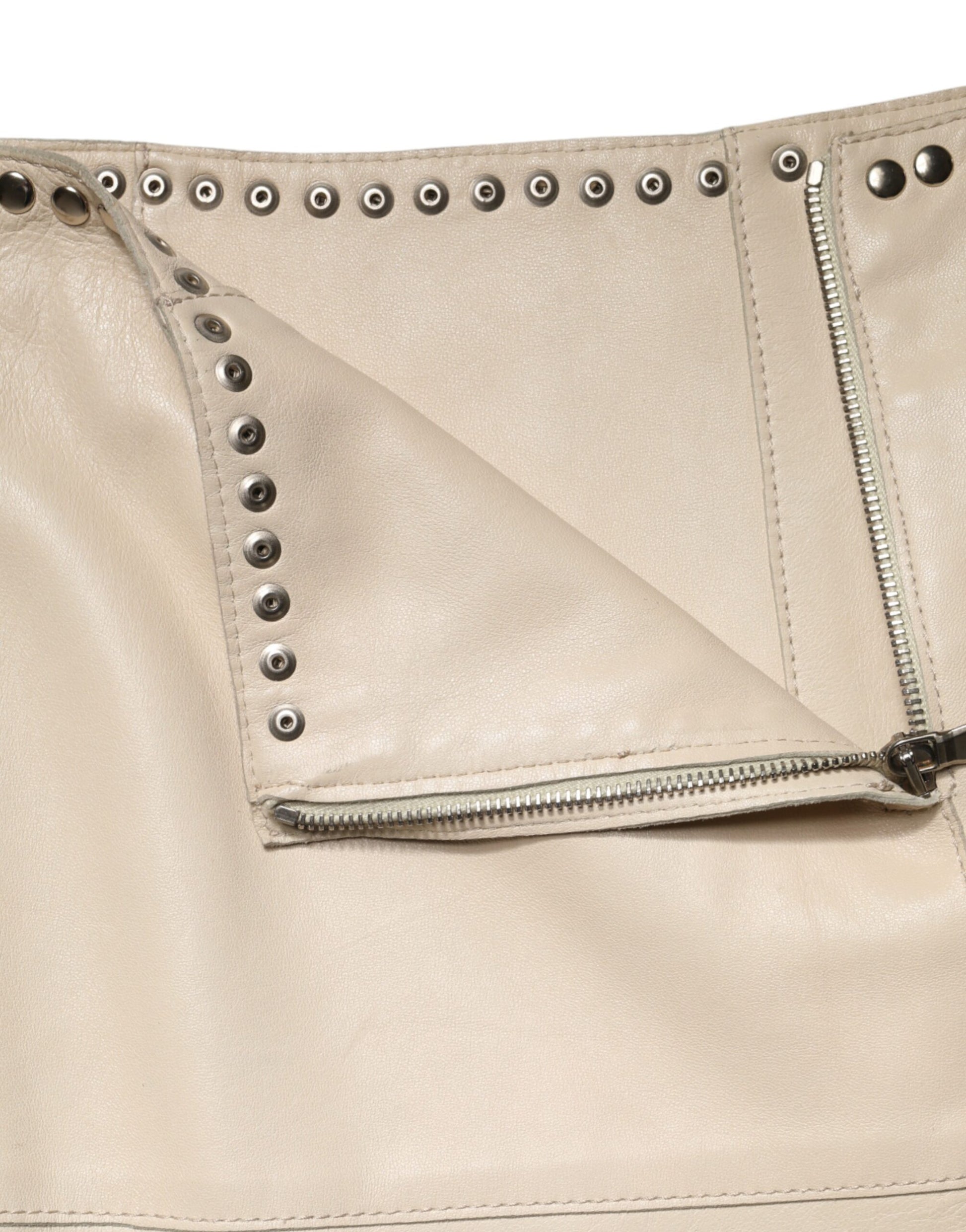A leather jacket with metal studs on the sleeve and zipper