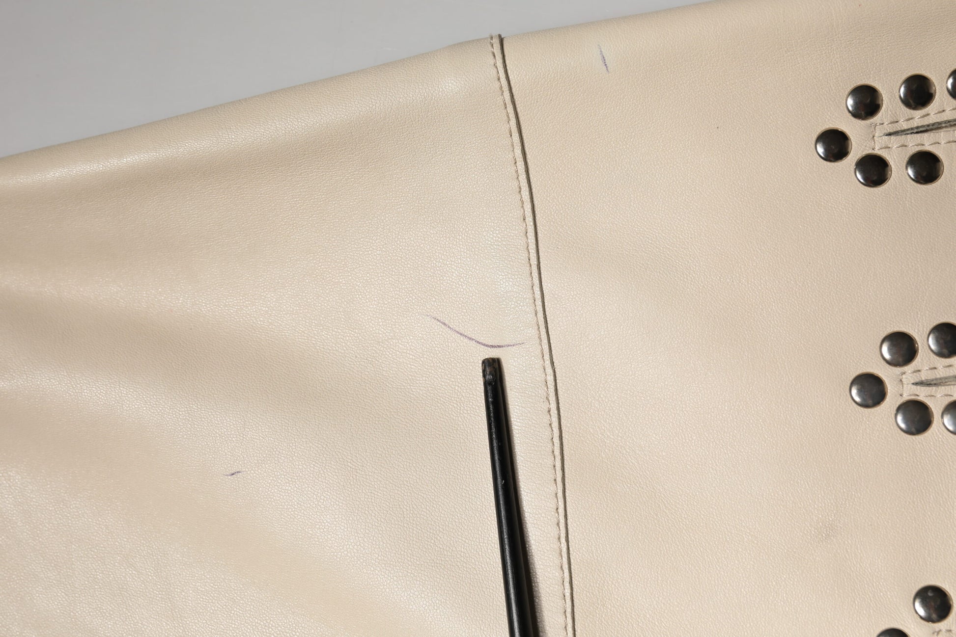 This is a wallet made of leather material. It has multiple pockets and compartments for organizing items
