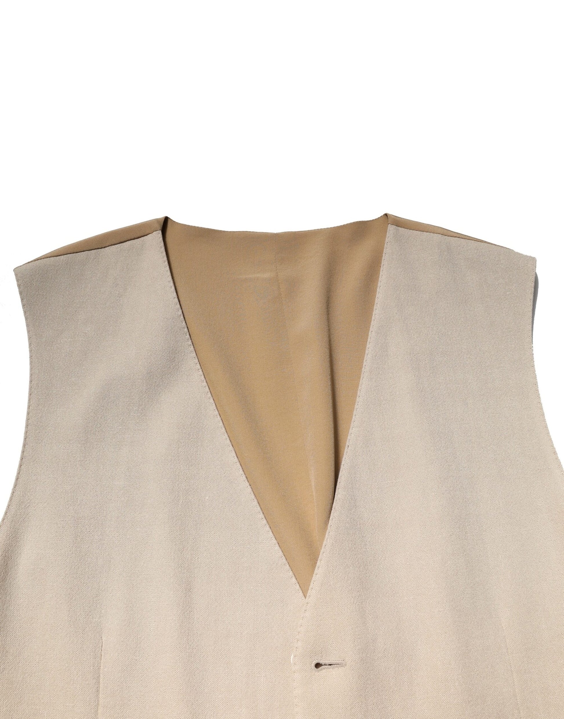 A beige linen vest with a V-neck and two pockets