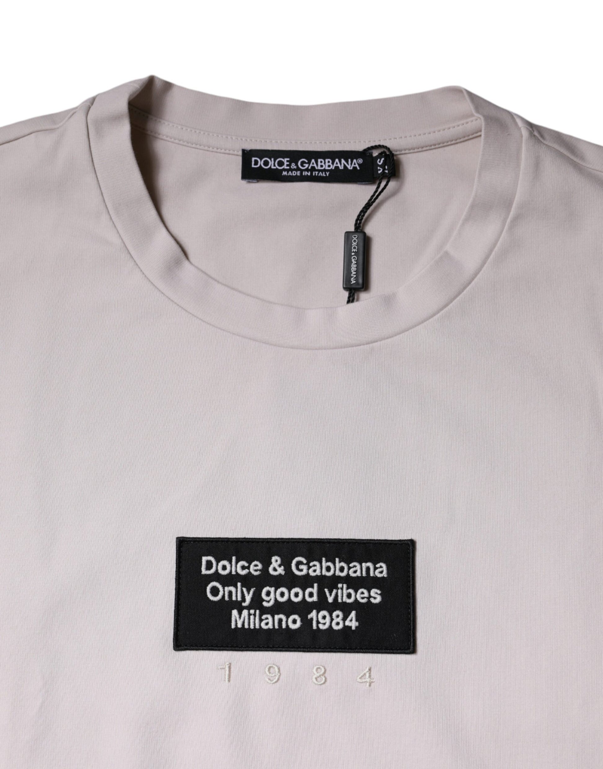 Tan t-shirt with black text and logo