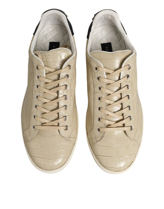 Pair of tan sneakers with crocodile skin texture on sides