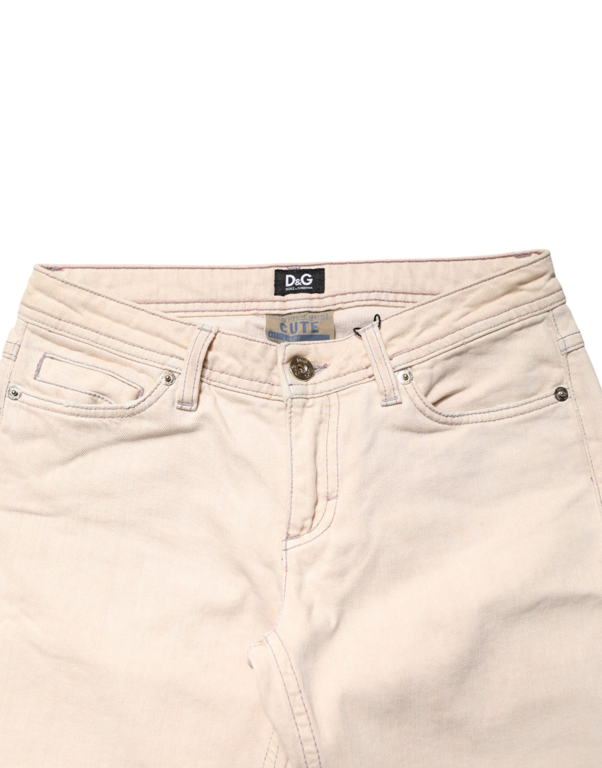 Pair of light beige women's jeans with visible brand label on waistband