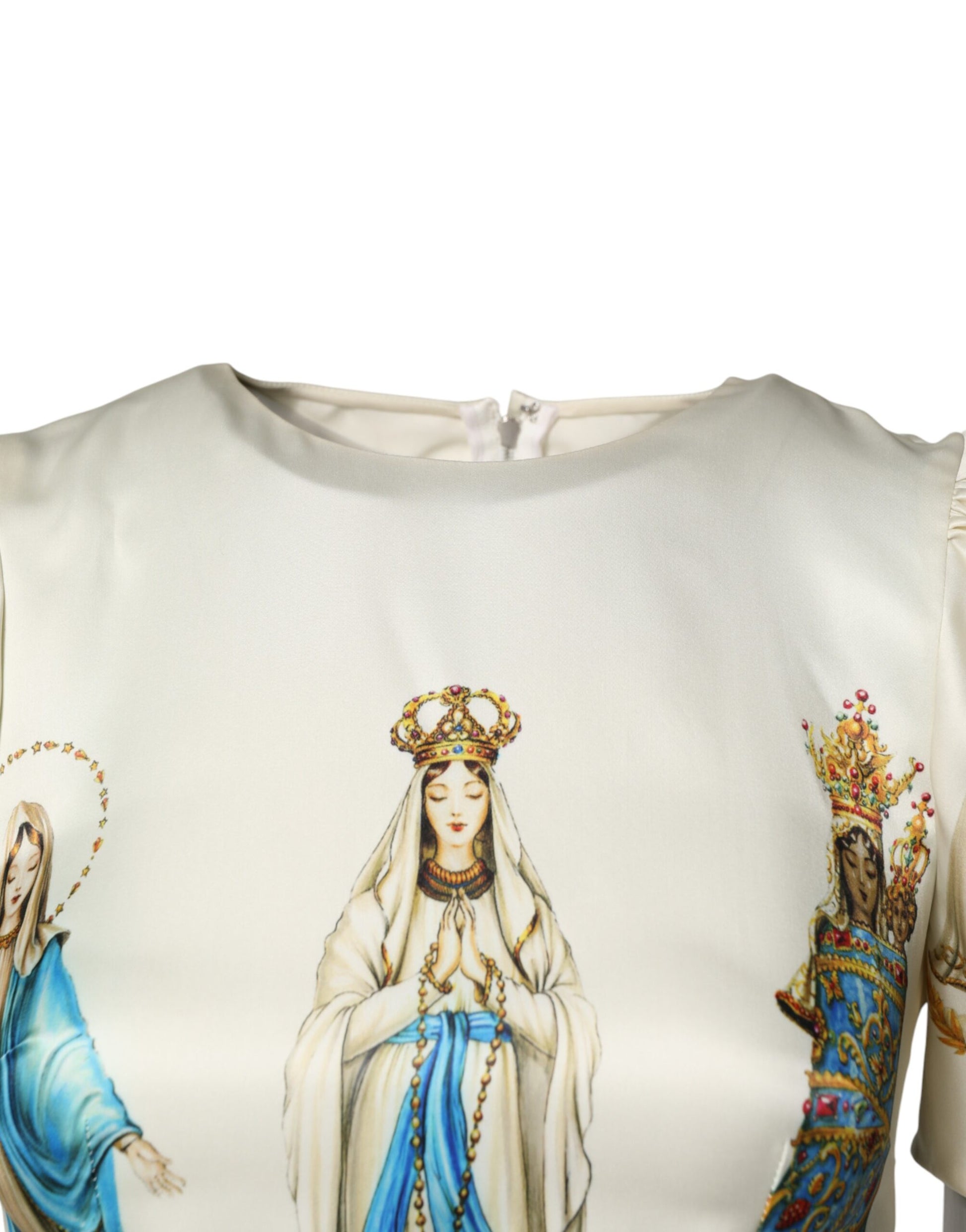 A garment with a religious artwork printed on it. The artwork depicts three figures that appear to be saints
