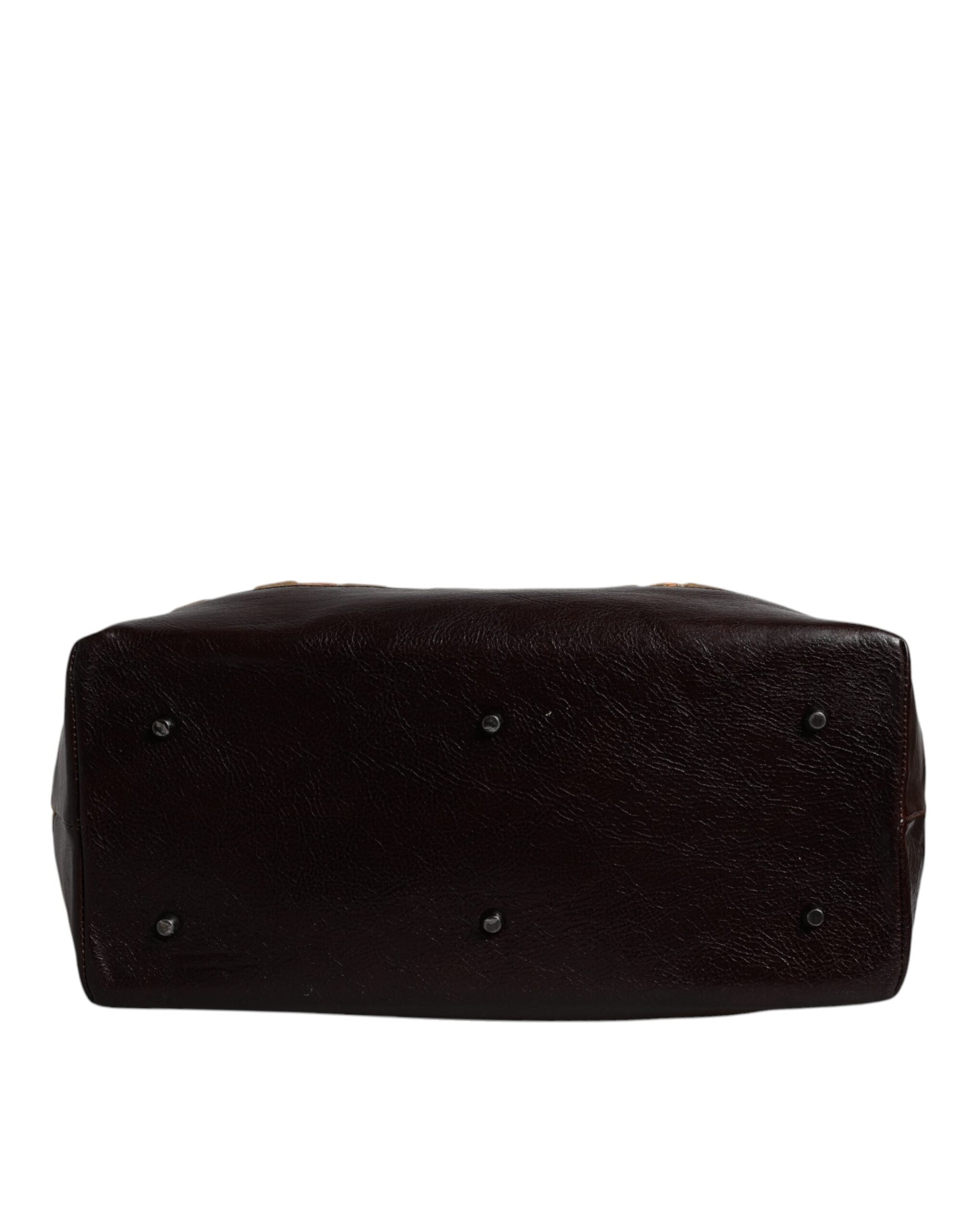 Dark brown rectangular object with ridged sides and circular patterns on top