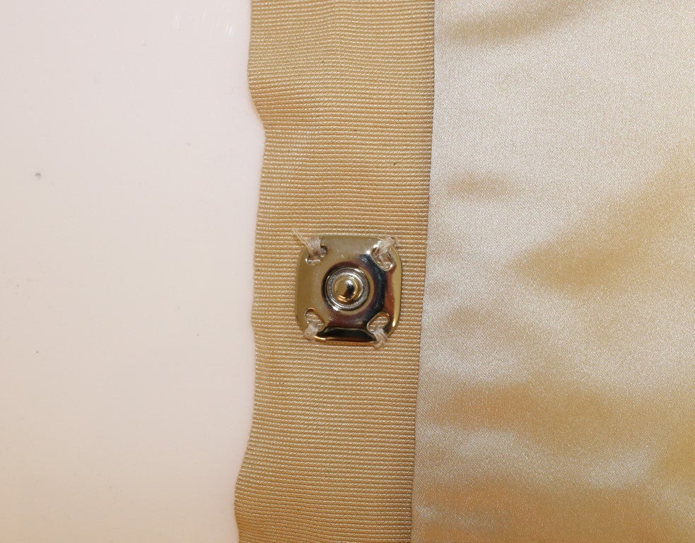 Gold button on fabric