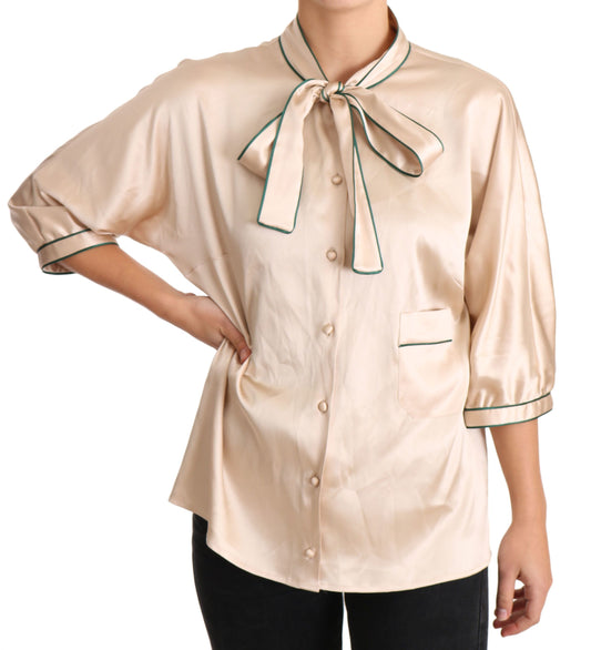 Tan shirt with bow tie on woman