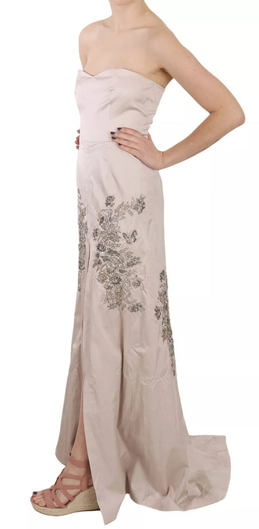 A beige sequined dress with a flared skirt and floral embroidery