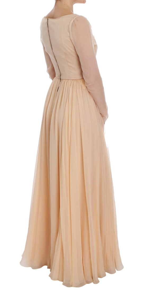 Long beige formal dress with ruffles on sleeves and hem
