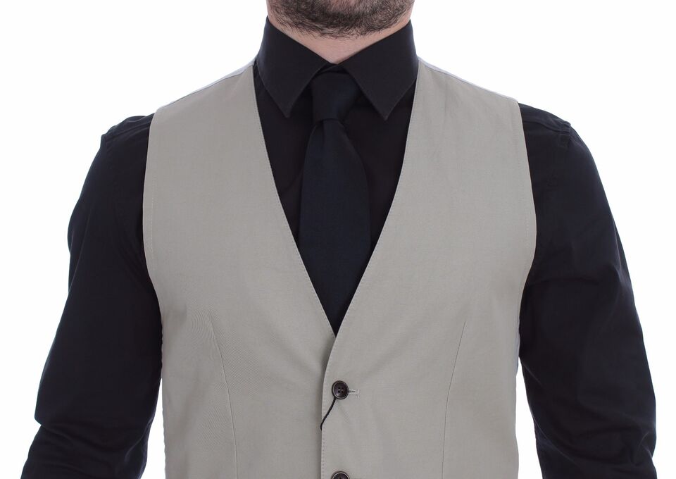 A beige silk blend vest with a black tie, part of a formal dress shirt and vest set