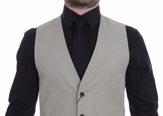 A beige silk blend vest with a black tie, part of a formal dress shirt and vest set