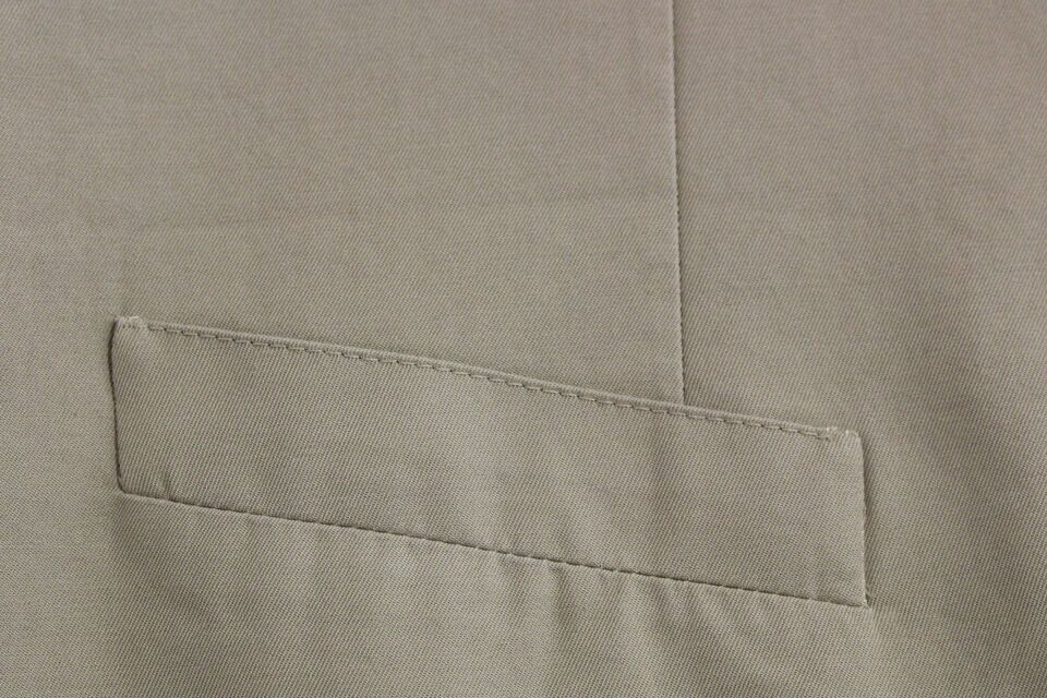 A beige silk blend vest with a formal design